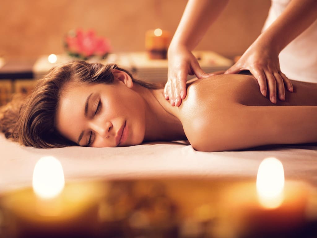young woman relaxing during back massage at the spa picture id469916170